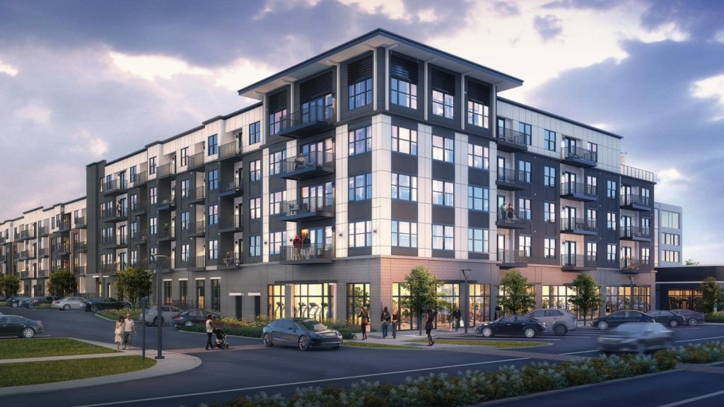 A modern five-story apartment building in Hilliard Ohio with large windows and balconies, perfect for senior independent living, surrounded by trees, parked cars, and people walking on the sidewalk under a partly cloudy sky.